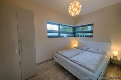 Ein Bett oder Betten in einem Zimmer der Unterkunft Apartment Tessera