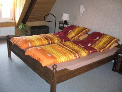 Ein Bett oder Betten in einem Zimmer der Unterkunft Ferienwohnungen im Fachwerkhaus