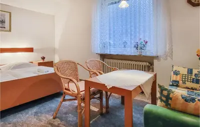 Ein Bett oder Betten in einem Zimmer der Unterkunft Nice Apartment In Goslar Ot Hahnenklee