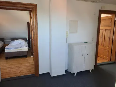 Ein Bett oder Betten in einem Zimmer der Unterkunft Gästehaus Harzstraße