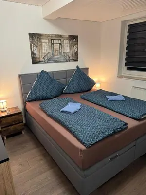 Ein Bett oder Betten in einem Zimmer der Unterkunft Blue Wave