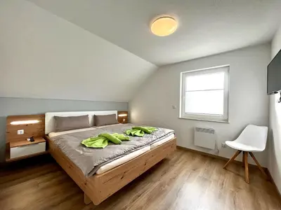 Ein Bett oder Betten in einem Zimmer der Unterkunft Ferienhaus Leni Bettwäsche Handtücher inkl