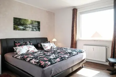 Ein Bett oder Betten in einem Zimmer der Unterkunft Ferienwohnung FANNYS