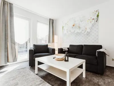 Ein Sitzbereich in der Unterkunft REBENTISCH - Hotel FERIENWOHNUNGEN Restaurant
