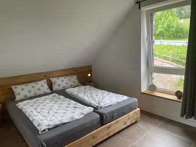Ein Bett oder Betten in einem Zimmer der Unterkunft Hubertusgrund