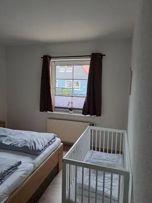 Ein Bett oder Betten in einem Zimmer der Unterkunft Ferienwohnung Olga