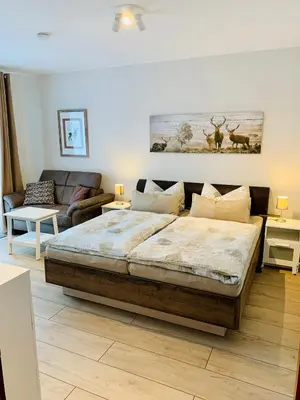 Ein Bett oder Betten in einem Zimmer der Unterkunft Haus Heidi Harz