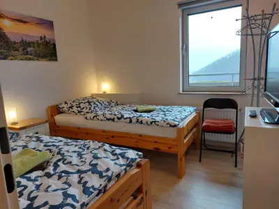 Ein Bett oder Betten in einem Zimmer der Unterkunft Ferienwohnung Penthouse Wolke 16 mit Schwimmbad und Saunanutzung