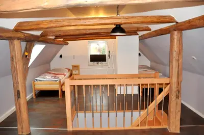 Ein Bett oder Betten in einem Zimmer der Unterkunft Ferienhaus Am Mühlenberg Thale Westerhausen