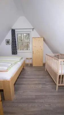 Ein Bett oder Betten in einem Zimmer der Unterkunft Ferienhäuser Ilsestein Einzelhaus, 130 qm, 4 Schlafzimmer