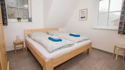Ein Bett oder Betten in einem Zimmer der Unterkunft Ferienhäuser Ilsestein Einzelhaus, 130 qm, 4 Schlafzimmer