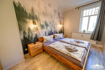 Ein Bett oder Betten in einem Zimmer der Unterkunft Auszeit-im-Harz Haus 1 Wohnung Schnarcherklippe