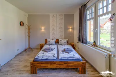Ein Bett oder Betten in einem Zimmer der Unterkunft Auszeit-im-Harz Haus 1 Wohnung Hexenstübchen