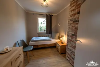 Ein Bett oder Betten in einem Zimmer der Unterkunft Auszeit-im-Harz Haus 3 Wohnung 3