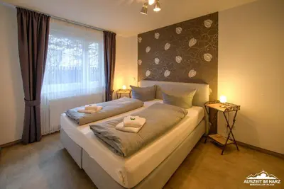 Ein Bett oder Betten in einem Zimmer der Unterkunft Auszeit-im-Harz Haus 6 Wohnung 2