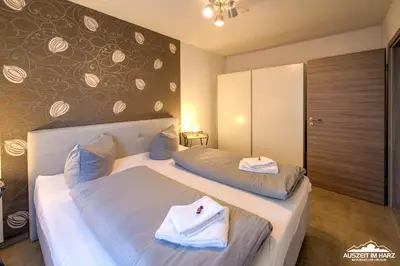 Ein Bett oder Betten in einem Zimmer der Unterkunft Auszeit-im-Harz Haus 6 Wohnung 2