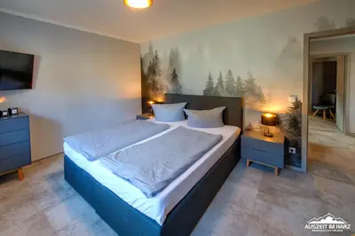 Ein Bett oder Betten in einem Zimmer der Unterkunft Auszeit-im-Harz Haus 6 Ferienhaus
