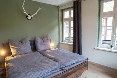 Ein Bett oder Betten in einem Zimmer der Unterkunft Zum Stadtknecht-inkl. Parkplatz