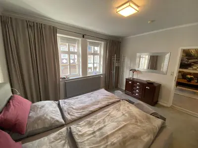 Ein Bett oder Betten in einem Zimmer der Unterkunft Ambiente am Breiten Tor Apartment 1