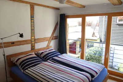 Ein Bett oder Betten in einem Zimmer der Unterkunft Ferienhaus Anno 1720