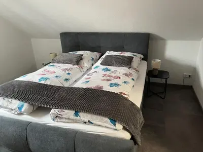 Ein Bett oder Betten in einem Zimmer der Unterkunft International 7