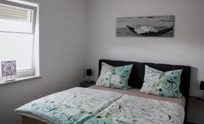 Ein Bett oder Betten in einem Zimmer der Unterkunft Ferienwohnung Gundermann