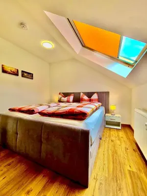 Ein Bett oder Betten in einem Zimmer der Unterkunft FeWo Füchse Braunlage I Verwaltung und Betreuung durch FIRMA ZZ-Braunlage