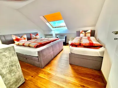 Ein Bett oder Betten in einem Zimmer der Unterkunft FeWo Ferien-Füchse ZZ-BRAUNLAGE