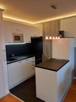 Küche/Küchenzeile in der Unterkunft Ferienwohnung Sagenstube im Panoramic Hohegeiß 16 Etage Fahrstuhl Hoch hinaus im Harz