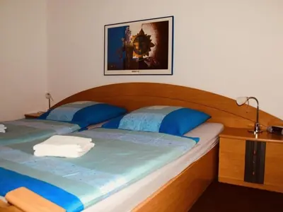 Ein Bett oder Betten in einem Zimmer der Unterkunft Ferienwohnung Mester mit Schwimmbad Sauna