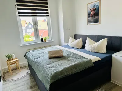 Ein Bett oder Betten in einem Zimmer der Unterkunft Lous Ferienhaus 3
