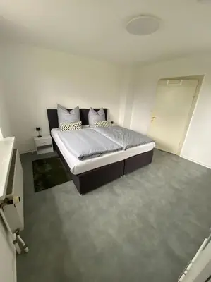 Ein Bett oder Betten in einem Zimmer der Unterkunft Haus PANORAMA - Appartement Auszeit 1