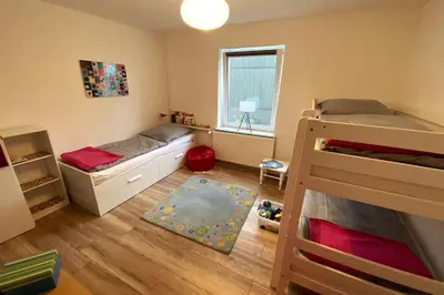 Ein Bett oder Betten in einem Zimmer der Unterkunft Haus PANORAMA - Appartement Auszeit 6