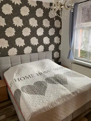 Ein Bett oder Betten in einem Zimmer der Unterkunft Fewo an der Stadtmauer