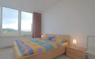 Ein Bett oder Betten in einem Zimmer der Unterkunft Penthouse 373