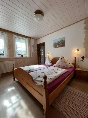 Ein Bett oder Betten in einem Zimmer der Unterkunft Gemütliche Ferienwohnung Nr. 1 im Harz für max. 3 Personen