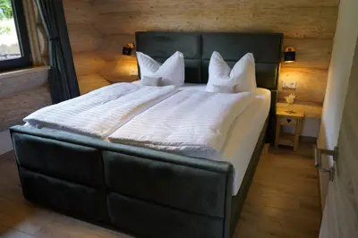 Ein Bett oder Betten in einem Zimmer der Unterkunft Tiefenbach-Chalet