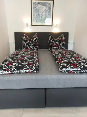 Ein Bett oder Betten in einem Zimmer der Unterkunft Burgberg-Blick