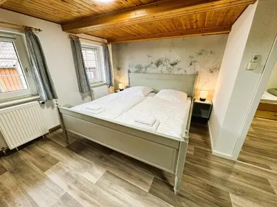 Ein Bett oder Betten in einem Zimmer der Unterkunft FeWo Dana im Haus HarzGlück
