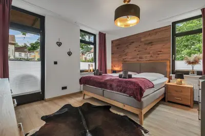 Ein Bett oder Betten in einem Zimmer der Unterkunft HIRSCH Stadt Apartment 1 - Terrasse mit Flussblick - Parkplatz
