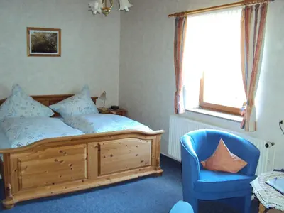 Ein Bett oder Betten in einem Zimmer der Unterkunft Ferienwohnungen Hasenpatt