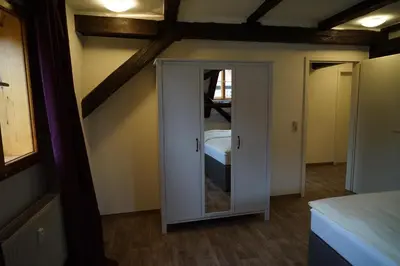 Ein Bett oder Betten in einem Zimmer der Unterkunft Kaufmannshaus Anno 1613
