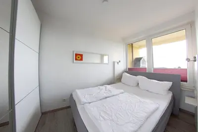 Ein Bett oder Betten in einem Zimmer der Unterkunft Apartment 454