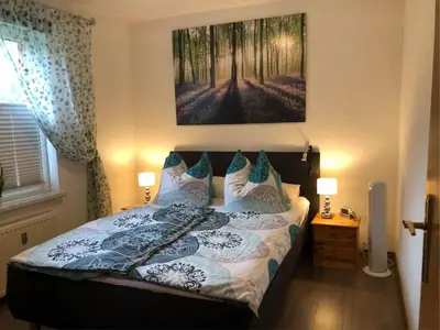 Ein Bett oder Betten in einem Zimmer der Unterkunft Ferienhäuser Am Eichenberg, Haus 3