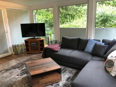 Ein Sitzbereich in der Unterkunft Ferienhäuser Am Eichenberg, Haus 3