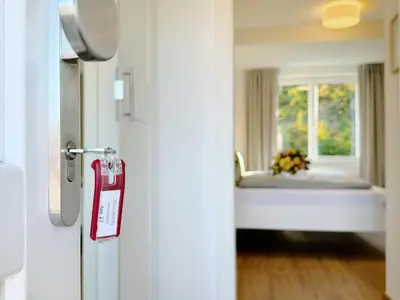 Ein Bett oder Betten in einem Zimmer der Unterkunft REGIOHOTEL Harzresidenz Wernigerode - #Familienfreundlich #FrischRenoviert #Waschmaschine #FreeParking