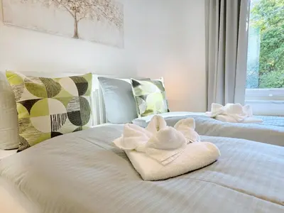Ein Bett oder Betten in einem Zimmer der Unterkunft REGIOHOTEL Harzresidenz Wernigerode - #Familienfreundlich #FrischRenoviert #Waschmaschine #FreeParking