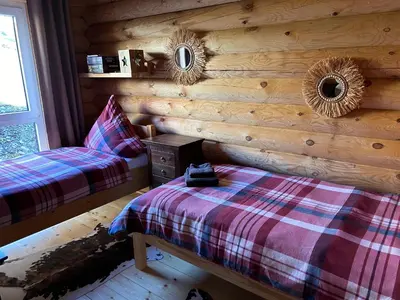 Ein Bett oder Betten in einem Zimmer der Unterkunft FeWo Traumzeit Hahnenkleer Hütte