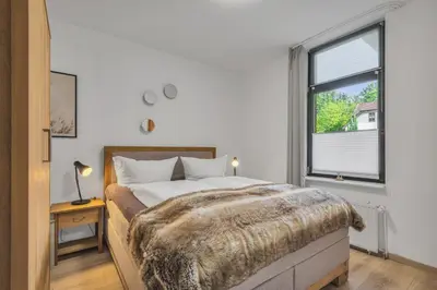 Ein Bett oder Betten in einem Zimmer der Unterkunft HIRSCH Stadt Apartment 3 - Balkon mit Flussblick - Parkplatz