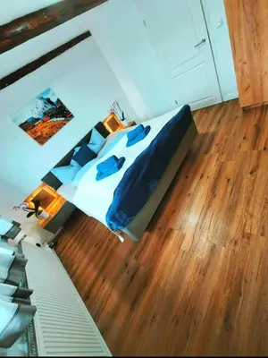 Ein Bett oder Betten in einem Zimmer der Unterkunft Ferienwohnung zu den Ilsefällen II